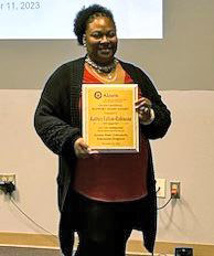 Katrice Felton-Robinson holds her award.