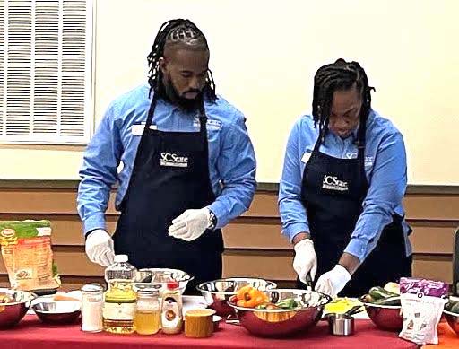 Extension professionals prepare food for demonstration.