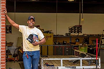 Joseph Spence, a graduate of Kentucky State University’s National Summer Transportation Institute, poses at North Hardin High School.
