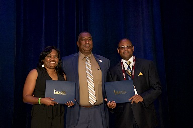 Dr. Allen Malone presents award for Excellence in Extension for the 1890 region to Berran Rogers.