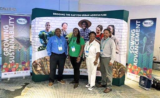 Scientist Dr. Thomas Nyatta with farmers at the National Urban Agriculture Conference.