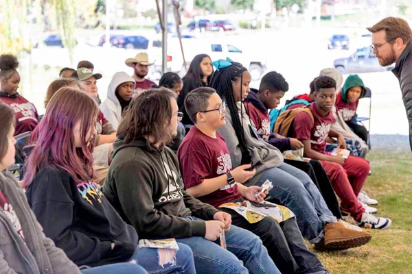 Group of youths at an outside event.