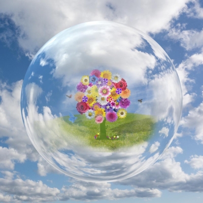 Bubble surrounds a tree with colorful flowers in the sky.