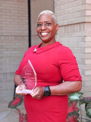 Nkenge Hyter holds her award.