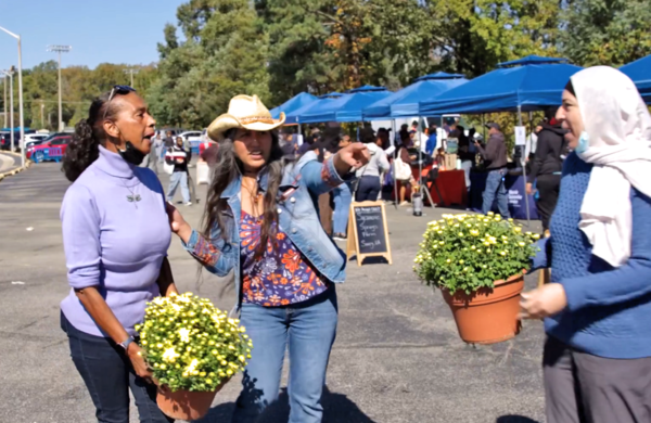 Community engages in farmers market.