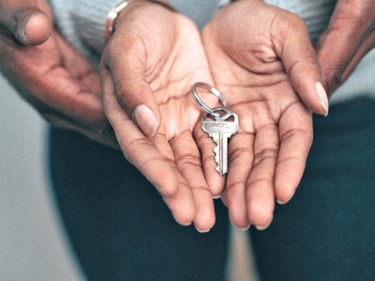 Keys in open hands.