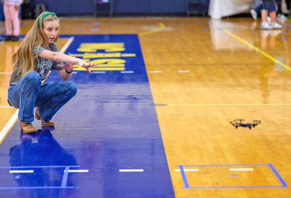 Union County High School team member Cora Medlin tries to coax her team’s drone.