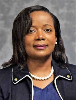 Headshot of Kimberly Sinclair-Holmes smiling.