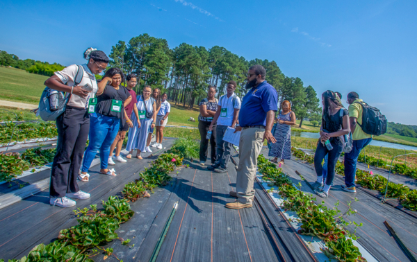 Trequan McGee, Ph.D., leads the YEA-REAP group on a tour of the university’s horticulture operation.