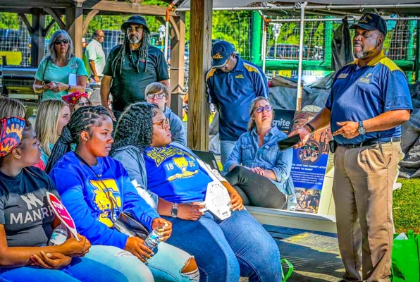 Woodie Hughes Jr. speaks to a group.