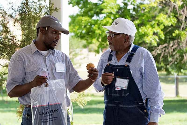 Two individuals talking.