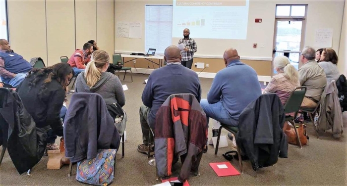 Dr. Sky Georges talks with a group of Extension agents about diversity and inclusion.