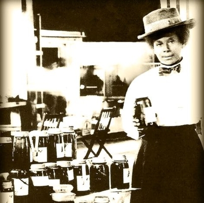 Annie Peters Hunter with jars of product.