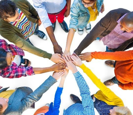 People connecting hands in a circle.