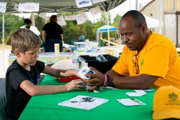 Louis Milligan, KYSU 4-H Youth Development agent, showcases the robotics program at a field day.