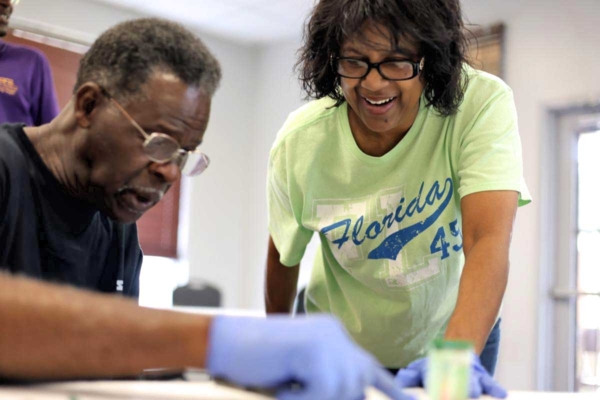 Participant engages in hands-on soil health workshop.