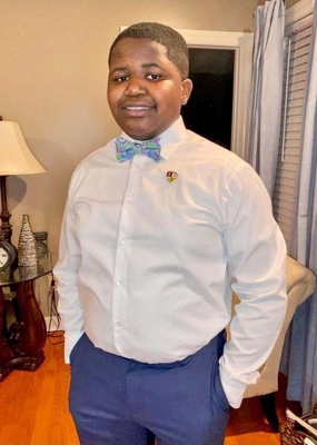4-H participant, Ashton Osborne, poses in a bow tie
