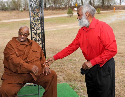 Jeffery Moore with a community member.