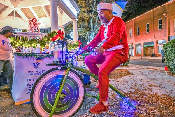 Fort Valley Mayor Jeffery Lundy pedals his way to a treat on a smoothie bike.