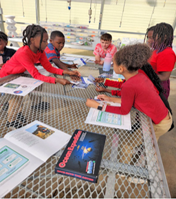 4-H students work on an experiment.