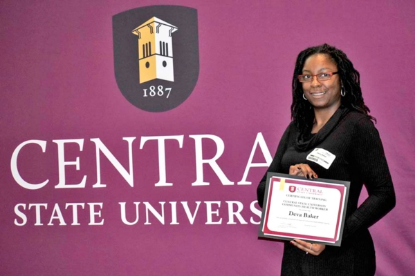 Deva Baker holds Community Health Worker Training Program certificate.
