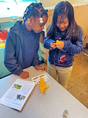 Fifth graders prepare for research mission with the ocean robot test tank activity.