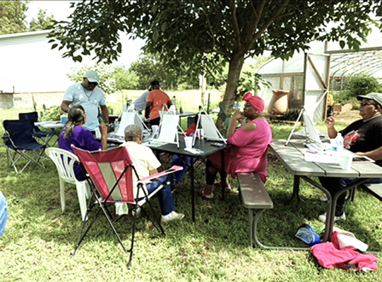Educator George DeMyers provides brain and health stimulation activities through painting projects.