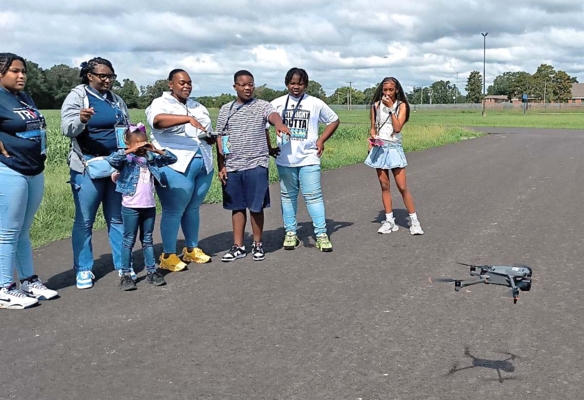 Students learn how to operate a drone.