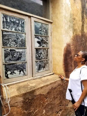 Dr. Pamela Moore observes artwork on the windows of a building at the Fort Jesus complex in Mombasa, Kenya.