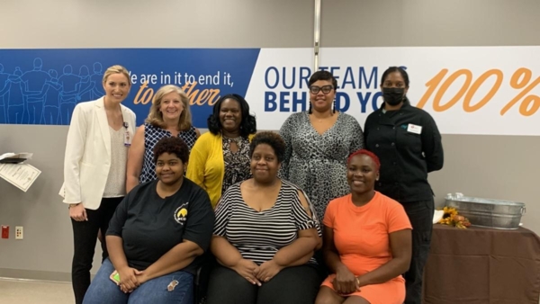 Participants pose for a photo following the Geaux Get Healthy community graduation.