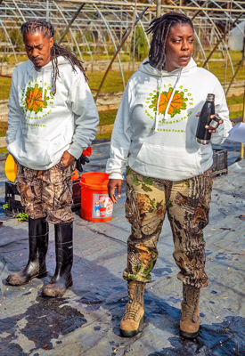 Fort Valley State University alumna, Kennise “Latricia” Elder, and her partner, Kwesi Elder, on the site of their urban farm.