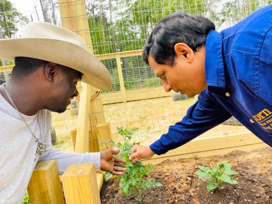 Researcher with farmer.