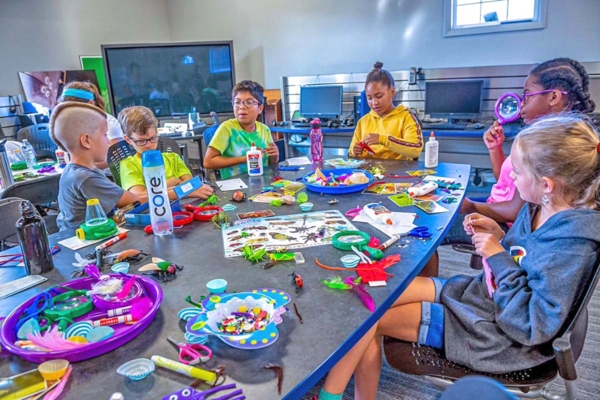 Group of youths engage in STEM activities.