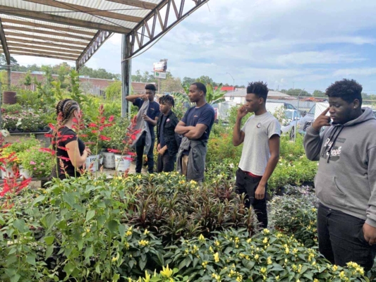 Non-traditional students participating in the Out of the Mud program took a field trip to an area plant nursery.