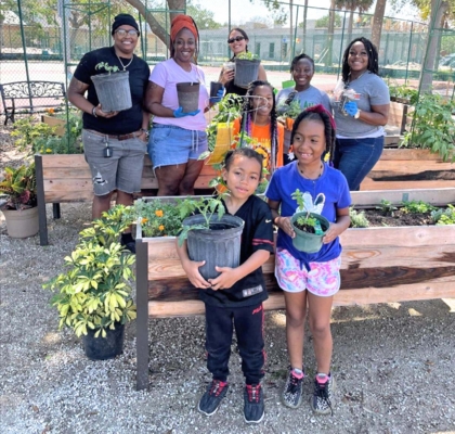 Coleman Park Community Garden residents and volunteers in garden.