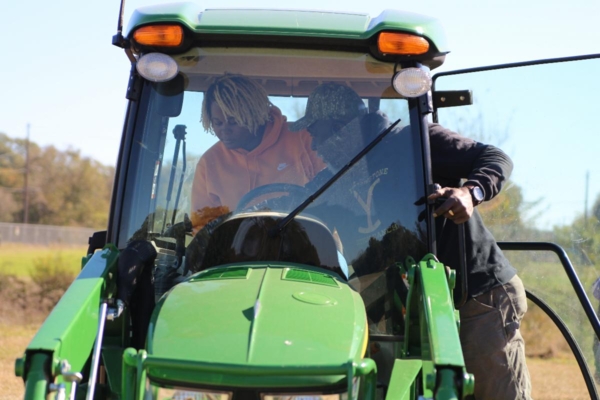 Student learns how to operate a tractor.