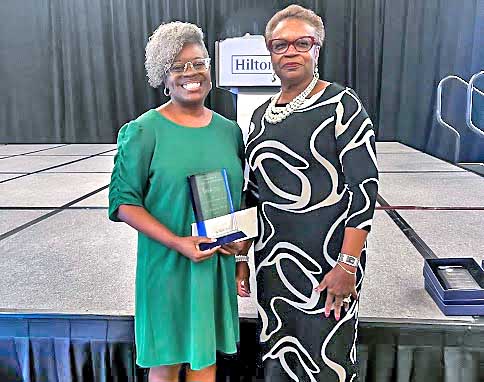 Dr. Rukeia Draw receives the Excellence in Extension Award.