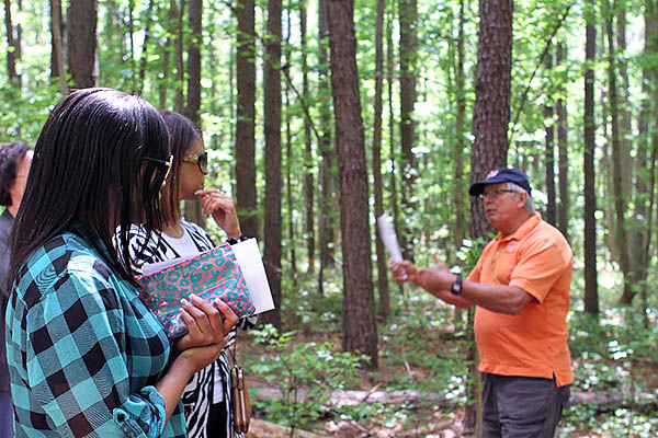 Joel Koci educates visitors about riparian buffers.