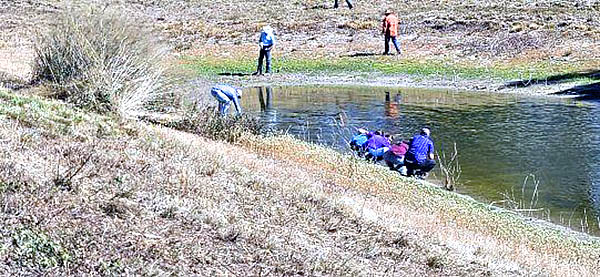 Group collects water samples.