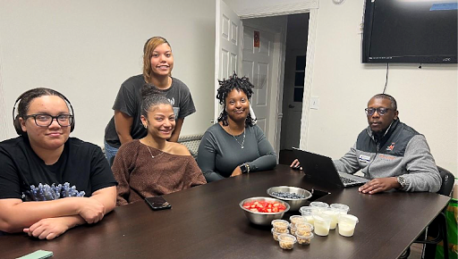 Nutrition educator conducts a round-table discussion with participants.