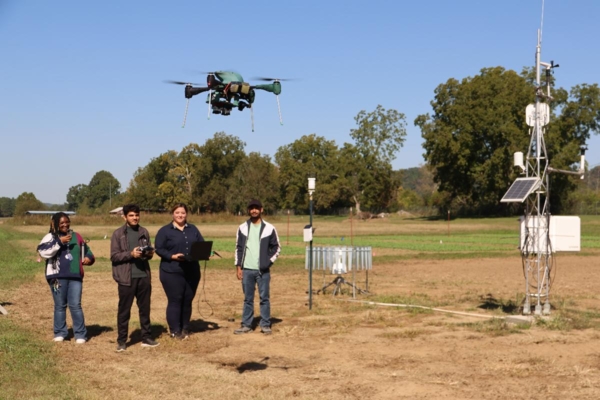 People flying a drone.