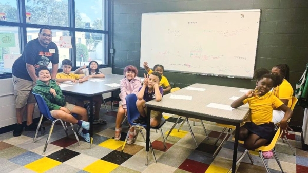 Extension agent with youth participants.