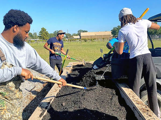 Group works on promoting the use of compost applications to improve soil health and water retention.